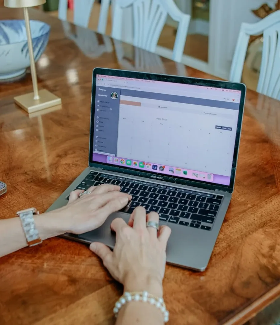 An agency owner working in Sittysites on a laptop